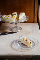 Italian pinoli, pine nuts, tart with cream on rustic background
