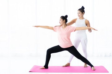 Women doing yoga exercise together