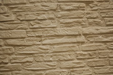 Muro beige di mattoni