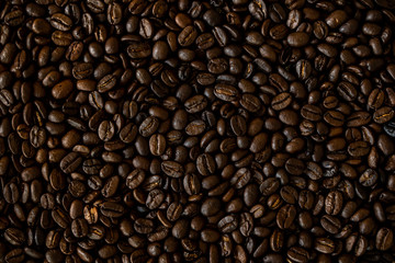 Medium roasted organic coffee beans close up. Coffee beans background.