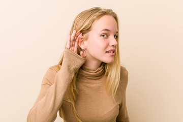 Fototapeta premium Cute and natural teenager woman trying to listening a gossip.