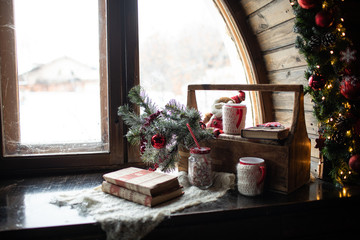 Christmas composition, on the window is the branches of the Christmas tree, Christmas toys, Santa Claus. New Year