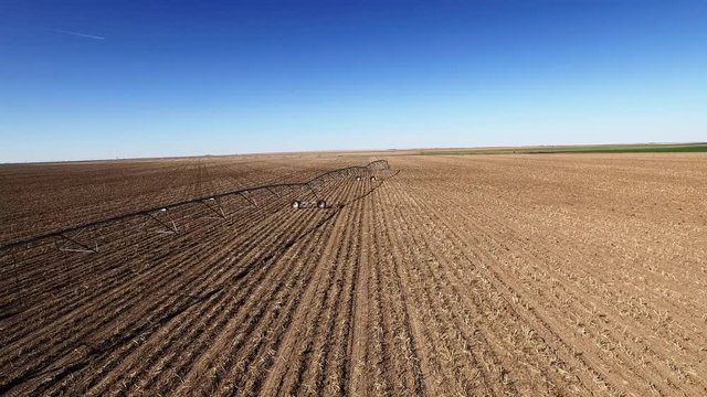 Irrigation system in dried Colorado field, wide aerial