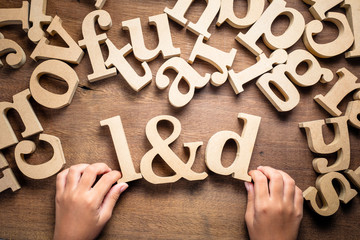 Child Arrange Alphabets as L&D (Learning and Development)