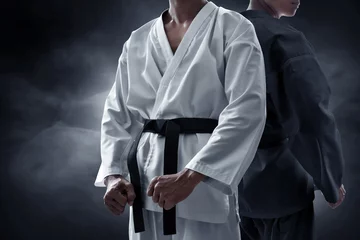 Fotobehang Two karate martial arts fighter on dark background © fotokitas
