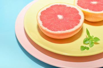 Naklejka na ściany i meble Grapefruit and Basil on a plate
