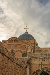 Fototapeta na wymiar Dome on Church of the Holy Sepulchre in Jerusalem on sky background