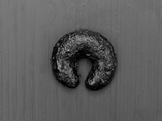 beautiful and modern black christmas cookies on black wooden background from above