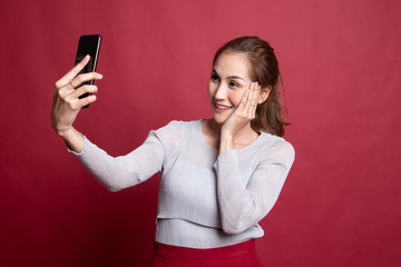 Naklejka premium Young Asian woman selfie with mobile phone.