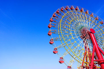 Colorful of Giant Ferris Wheel with blue sky