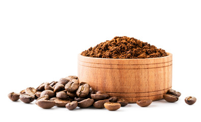 Ground coffee in a wooden plate and coffee beans on a white background.