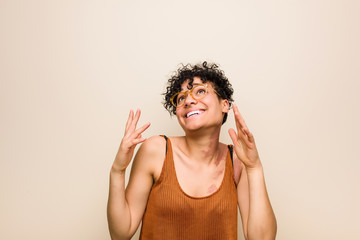 Young african american woman with skin birth mark joyful laughing a lot. Happiness concept.