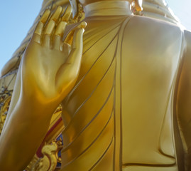 closeup hand of golden buddha statue