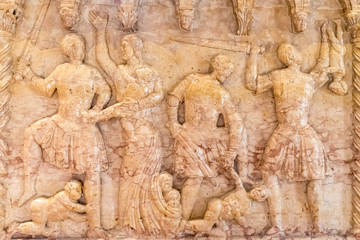 Fototapeta na wymiar Scene of The slayer of the innocents carved on a marble wall