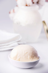 Mozzarella cheese next to sourdough for cheese close-up, on a light background