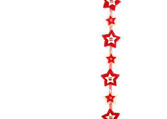 Christmas garland with carved red felt stars on white yellow background. Concept for greeting cards, invitations with copy space