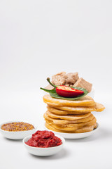 cornmeal tortillas on a white plate nearby. Mexican cuisine.