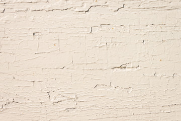 Obraz premium The old wooden surface is painted with white oil paint. Close-up. Texture. Abstract background