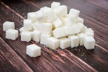 sugar cubes on a wooden table