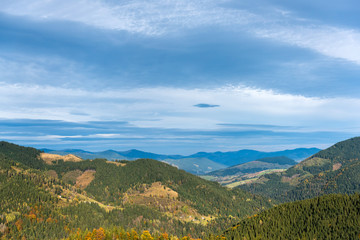 Amazing mountain landscape with colorful vivid sunset on the blue sky