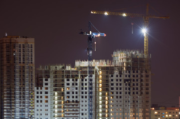 High-rise building under construction in the dark
