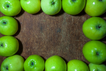 Flat lay Apple pattern top view with place for text. Rectangular fruit Frame or Border with juicy apples on wooden rustic surface
