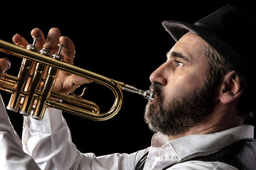 trumpet man with beard portrait on black - obrazy, fototapety, plakaty