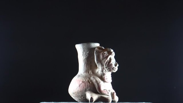 Pan Rotating left to right High Definition HD Video Clip Footage of statue of  old myan god vase