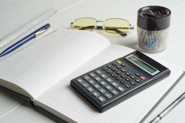 Workplace of an accountant, notebook, calculator