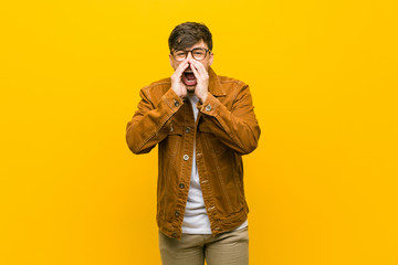 Young hispanic casual man shouting excited to front.