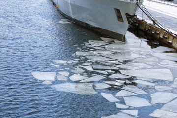 Warship in port during winter.