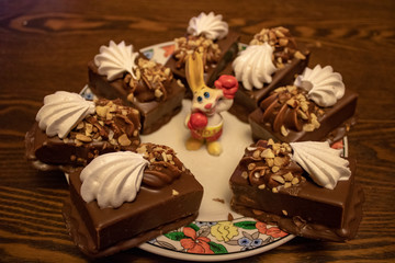 Chocolate cake made from natural ingredients with nuts, a souvenir, a hare, a boxer for the New Year and any holiday