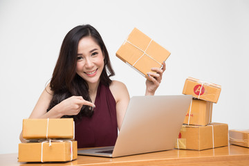 Young asian women with startup small business entrepreneur freelance working at home and excited about the orders of many customers, Online marketing packing box delivery concept, Thai model