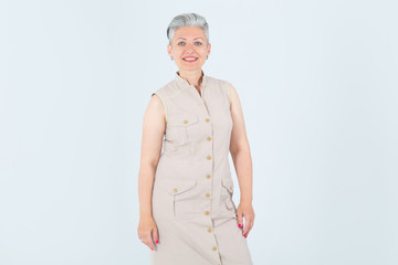 Beautiful mature woman on a light background.