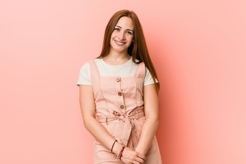 Obraz premium Young ginger woman with freckles happy, smiling and cheerful.