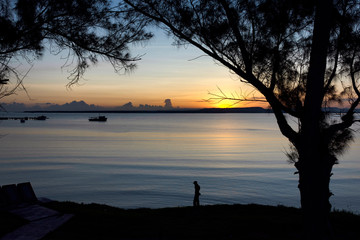 Sunrise landscape with shadowed man in the Gibara, Cuba bay