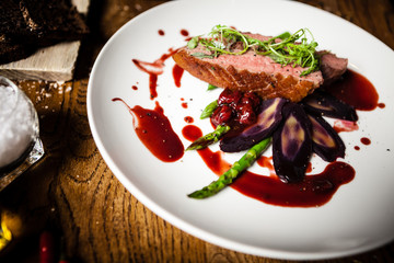 Duck breast served on a plate in restaurant