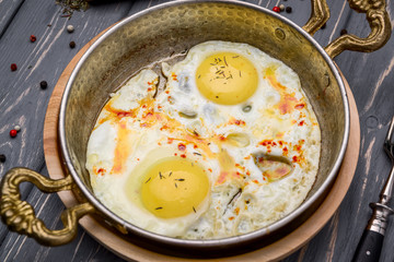 Fried eggs in a frying pan. Breakfast, Healthy food.