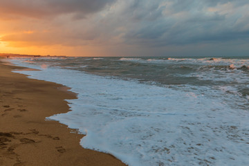 Stormy sunset on the sea coast