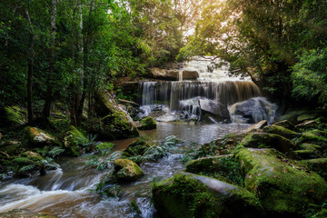 Phonpob waterfall, a beautiful waterfall in a forest filled with green trees at Phu Kradung National Park in the rainy season, which is famous tourist destination in Thailand.