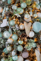 Obraz premium Decorated Christmas tree on blurred, sparkling and fairy background