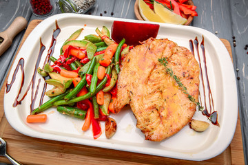 Grilled steaks, baked potatoes and vegetables