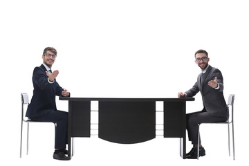 two business people discussing something sitting at the table