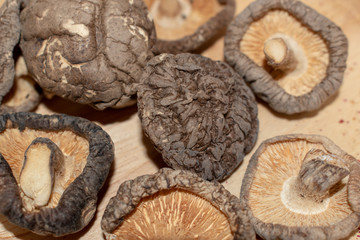 Shiitake mushrooms dried in a wooden tray.
