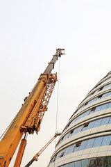 crane arm and glass curtain wall