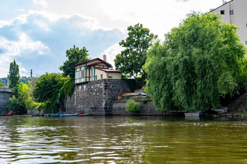 Scenic panorama cityscape view of Moldava river boat Prague in Czech Republic.