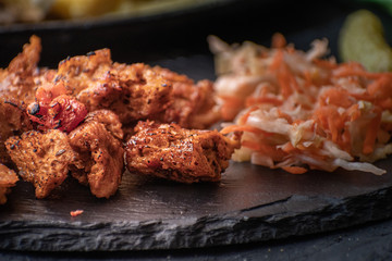 Grilled vegan meat, seitan, on slate plate