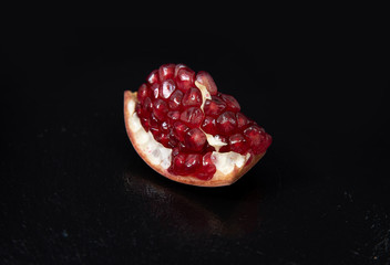 pomegranate on a black background