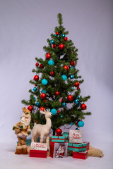 Christmas tree with toys and gifts on a white background