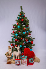 Christmas tree with toys and gifts on a white background